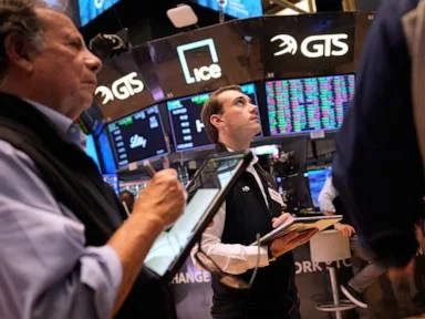 Asian stocks are mixed after Wall Street slips following Fed's rate hike decision