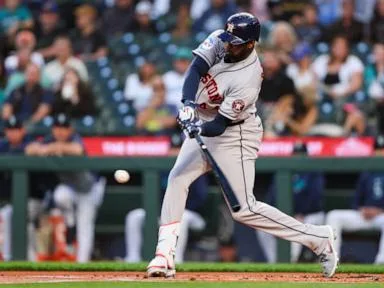 Alvarez hits 41st homer and drives in 3 as Astros blank Mariners 7-0 to tie Rangers atop AL West