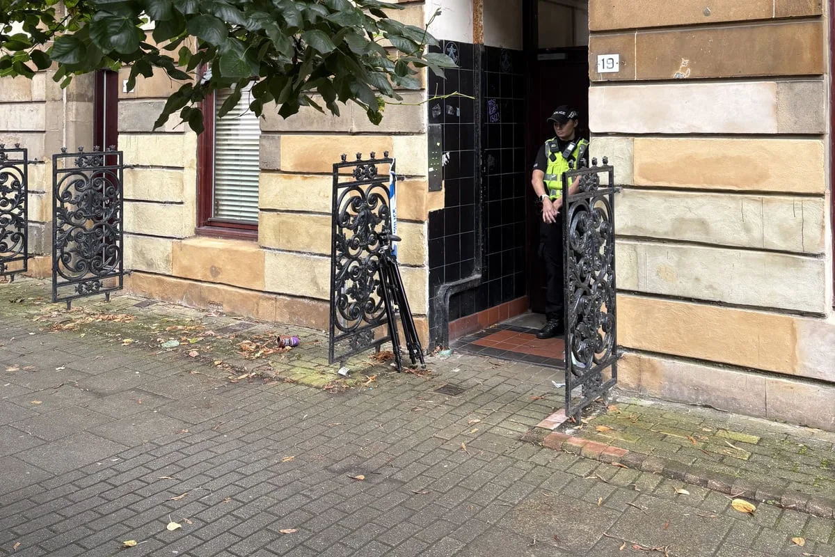 Double murder hunt launched after two men found dead in flat