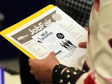 Americans applying for jobless aid slips to 203,000 as layoffs remain low