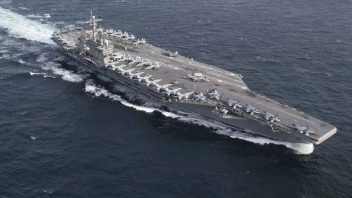USS Abraham Lincoln sails past Singapore on way home after gruelling Middle East deployment