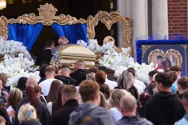 Gold coffin carried through streets as mourners gather for teen killed in M9 crash