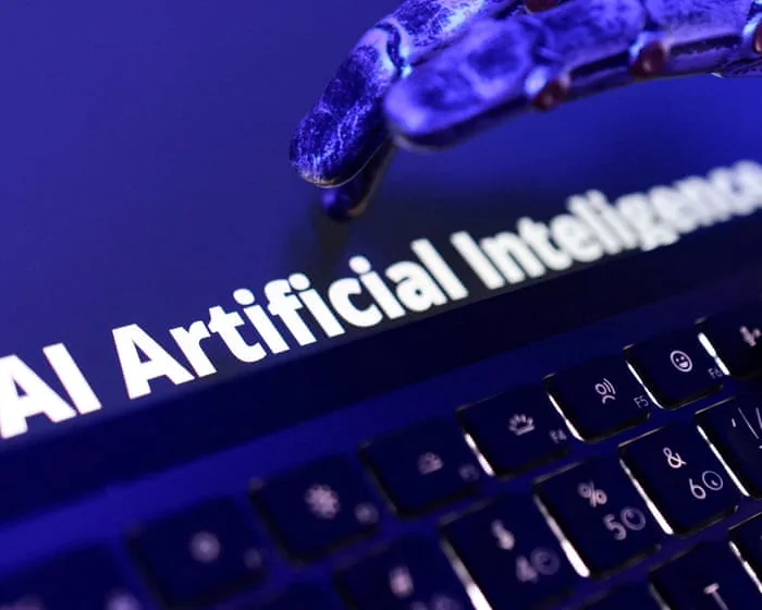AI-linked stocks fall after call for development slowdown worries investors – business live
