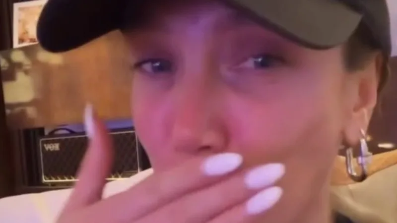 Delta Goodrem fights back tears in injury update