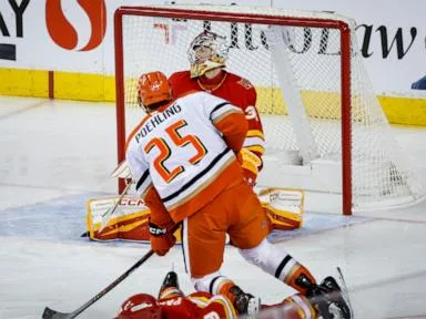 Ducks beat the winless Flames 4-2 in Calgary to start a home-and-home series