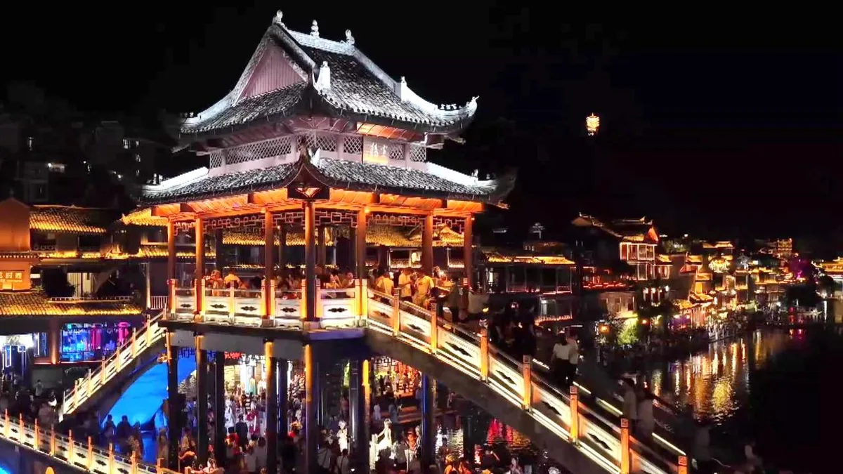 Fenghuang's immersive boat tours light up summer nights