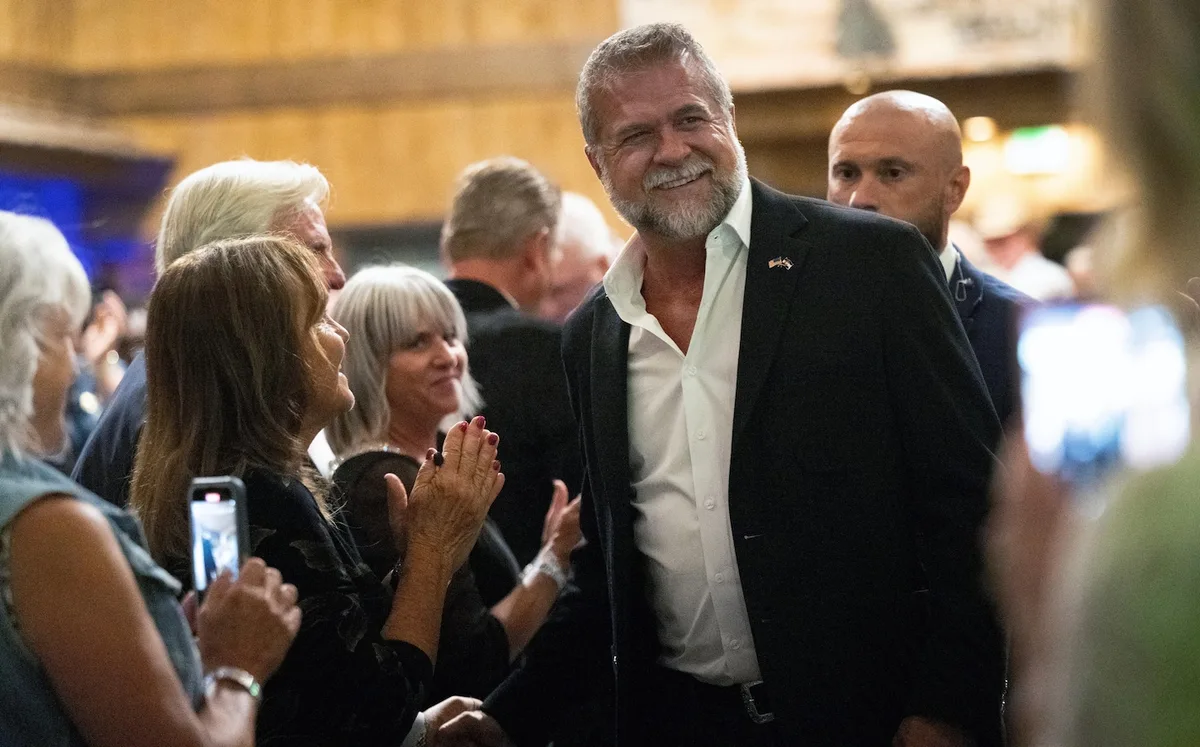 A candidate says he slammed his wife against a door. She says he’s not an abuser.