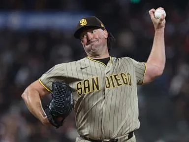 Ray gets 100th career win as Padres hold off Giants 7-5 to maintain wild-card edge