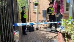 Four charged with murder after baby stabbed to death