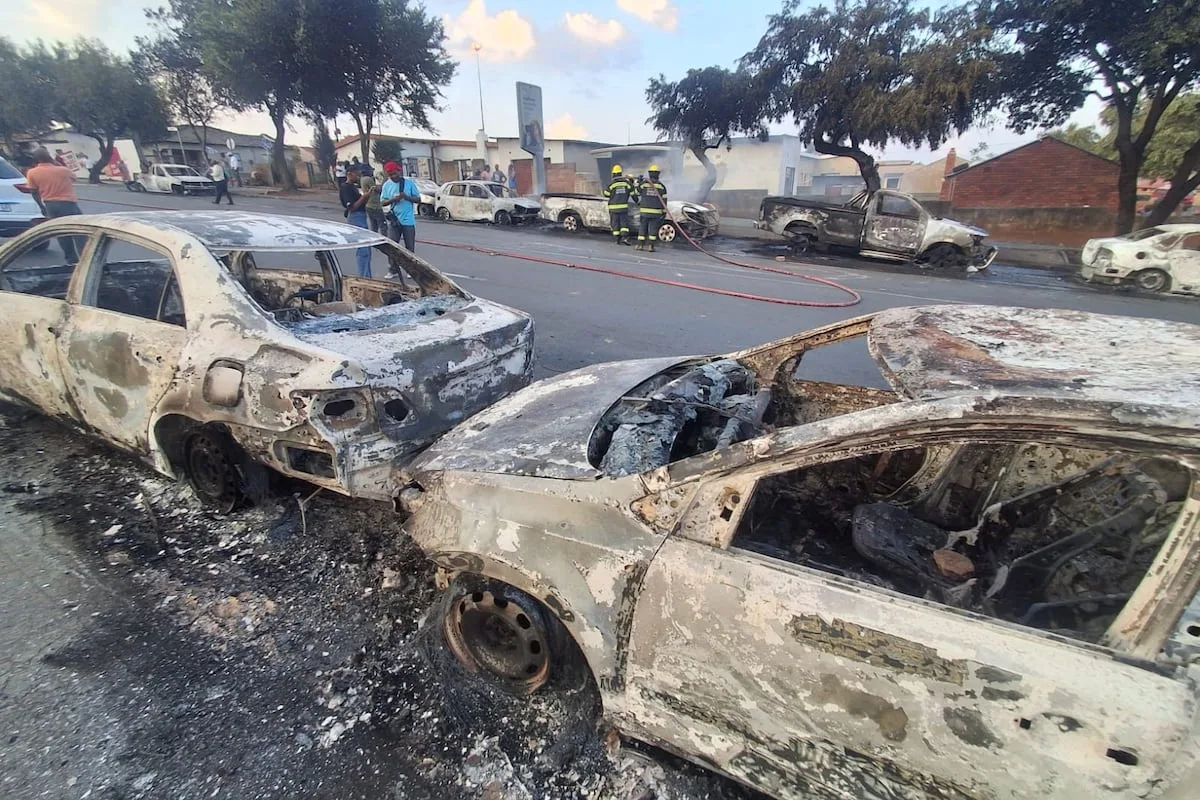 WATCH | 24 cars burnt, shops looted, foreigners evicted as asylum process sparks anger