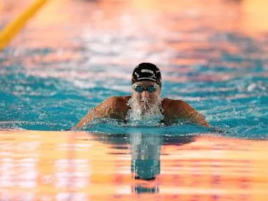 Kate Douglass blazes to 50 free world record in Pan Pacific prelims