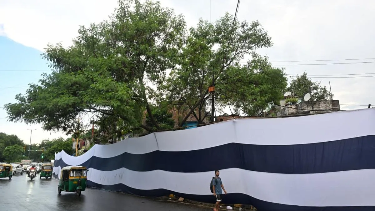 ‘Are we dirt and garbage?’: Slum dwellers react to banners covering homes during BRICS Summit