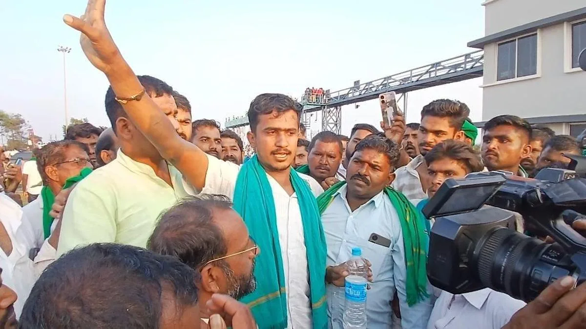 Farmers stop youth from jumping from signpost during protest