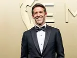 Apple's new CEO John Ternus shows off the iPhone Duo on the Emmys red carpet - as delighted fans call him the 'coolest person in the room'