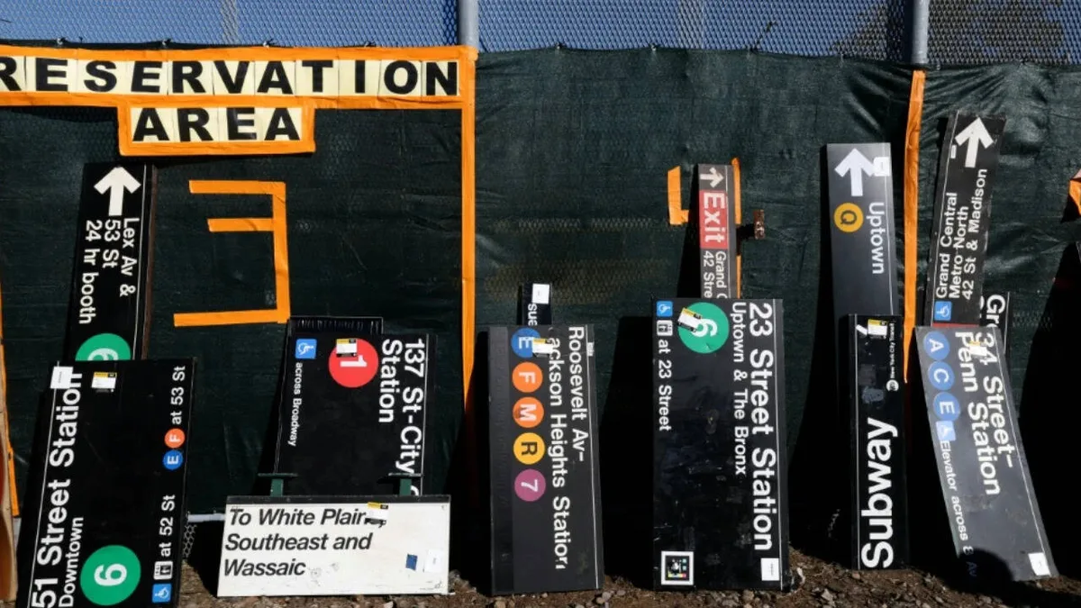 New Yorkers queue for hours to buy old subway signs and seats at MTA sale