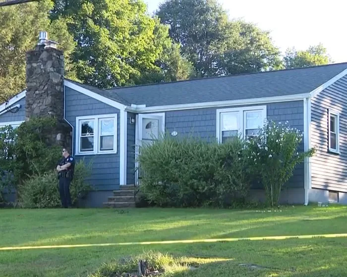 Arrest warrant issued for wife of Massachusetts officer found dead at home