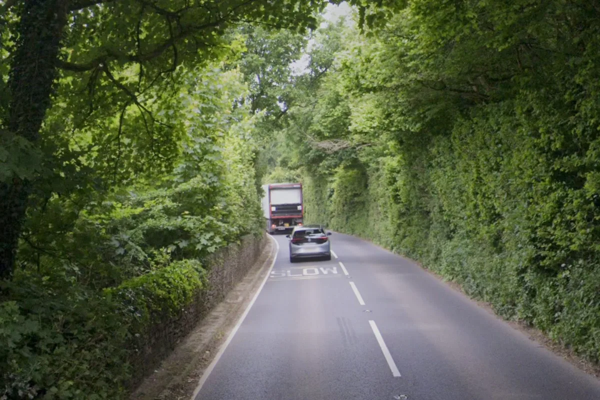 Driver arrested after woman dies in three-car crash on busy Devon road