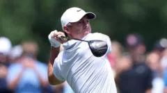 McIlroy improves to go joint-second as Clark retains lead