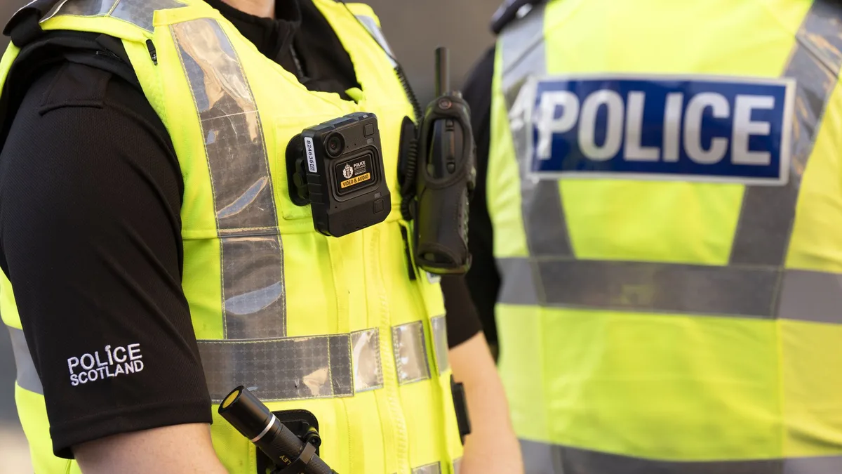 Man charged and woman in court amid investigation into attempted murder of police officers