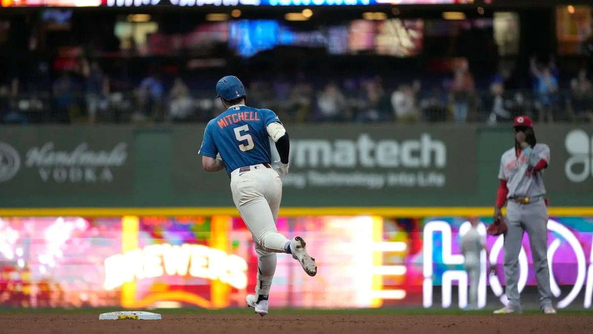 Garrett Mitchell hits grand slam and MLB-best Brewers pound Reds 20-0 to clinch playoff spot