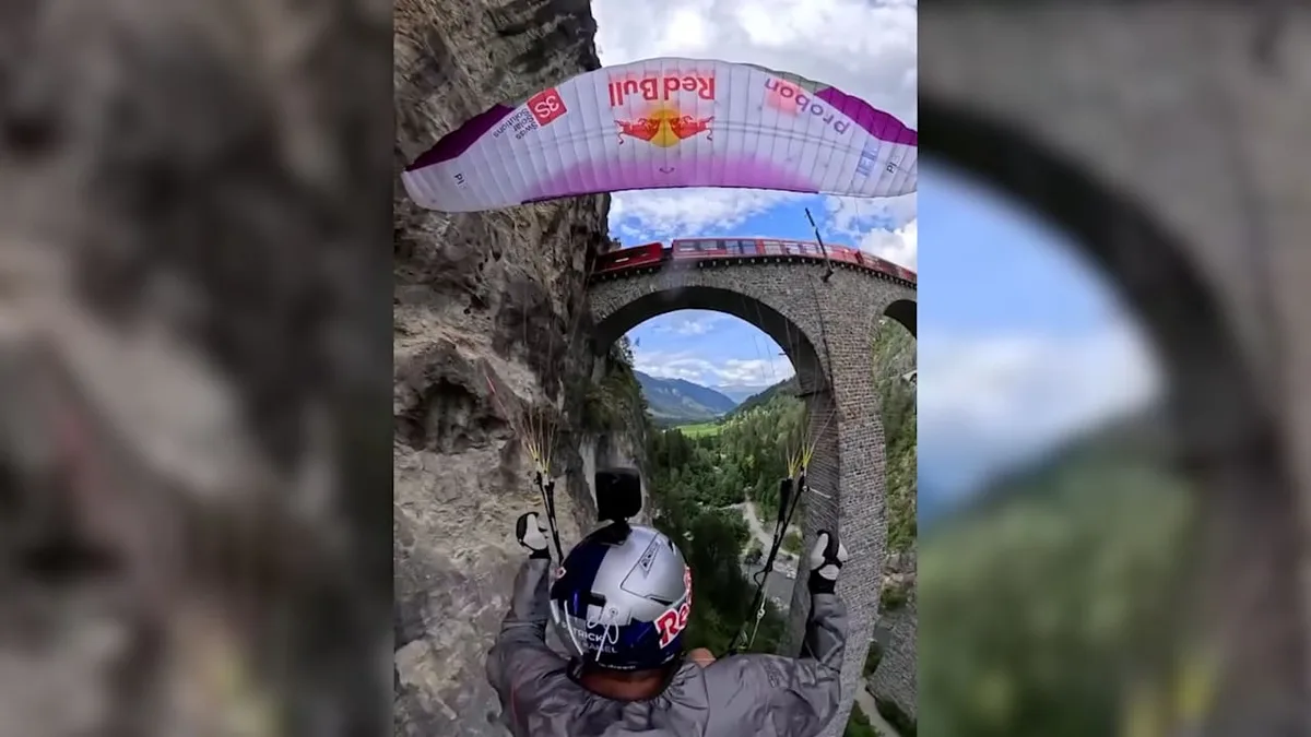 Nervenkitzel durch das Tal - Extrem-Paraglider rauscht im Slalom durch Viadukt