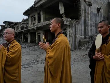 Nepal holds a day of mourning after floods kill at least 1,300 people