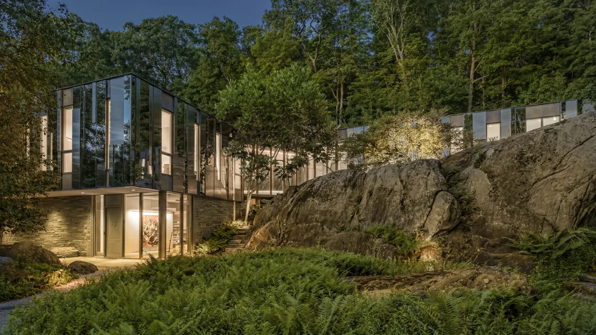 This $15 million New York home almost disappears into the forest on its 19.5-acre wooded estate