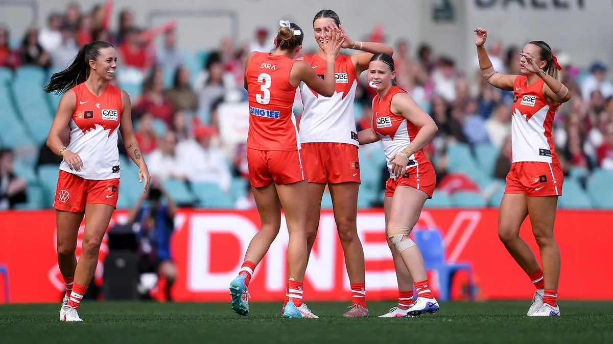Swans AFLW team ride record support for Bombers win