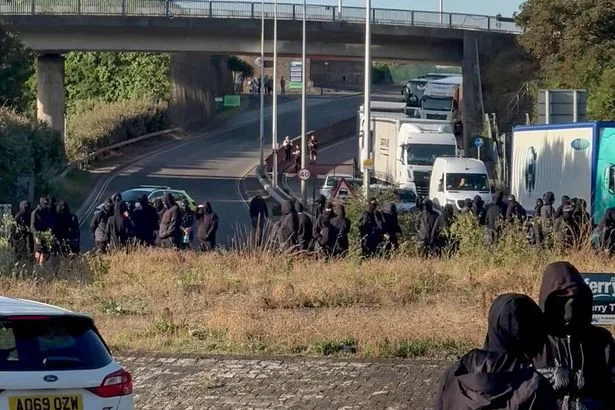 Police say masked protesters face arrest as city braces for anti-migrant rally