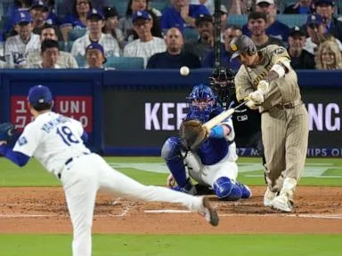 Machado powers the Padres past the Dodgers 5-1, snapping Los Angeles' 11-game home winning streak