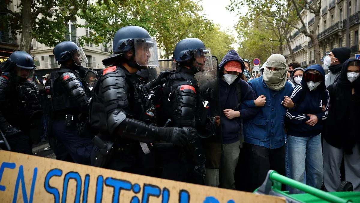 France suspends use of stun grenades to police student protests