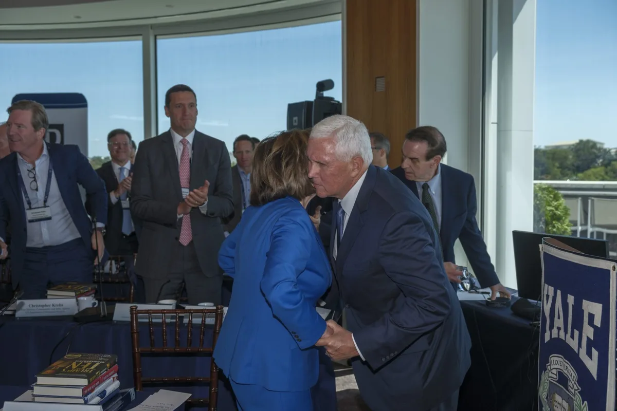 Exclusive: Inside the room where Nancy Pelosi and Mike Pence shared an emotional embrace in front of America’s leadership class