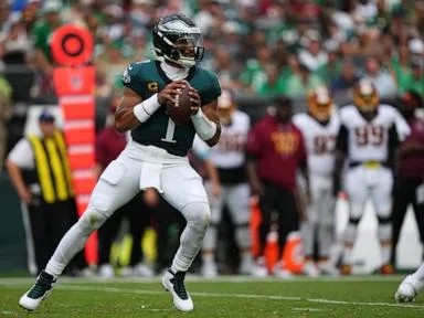 Jalen Hurts throws 3 TD passes and Eagles stuff Commanders' late 2-point try for 24-22 win