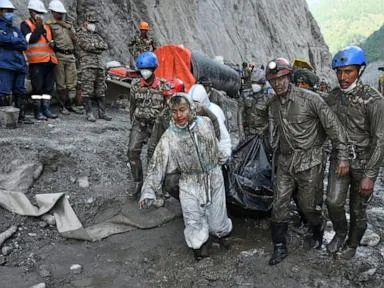 Rescuers dig 4 bodies from a Nepal hydropower tunnel as families demand answers