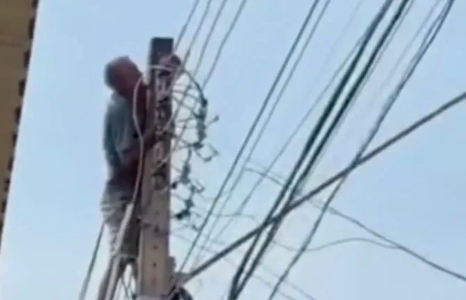 Homem morde fiação elétrica, leva choque e cai de poste em Porto Velho