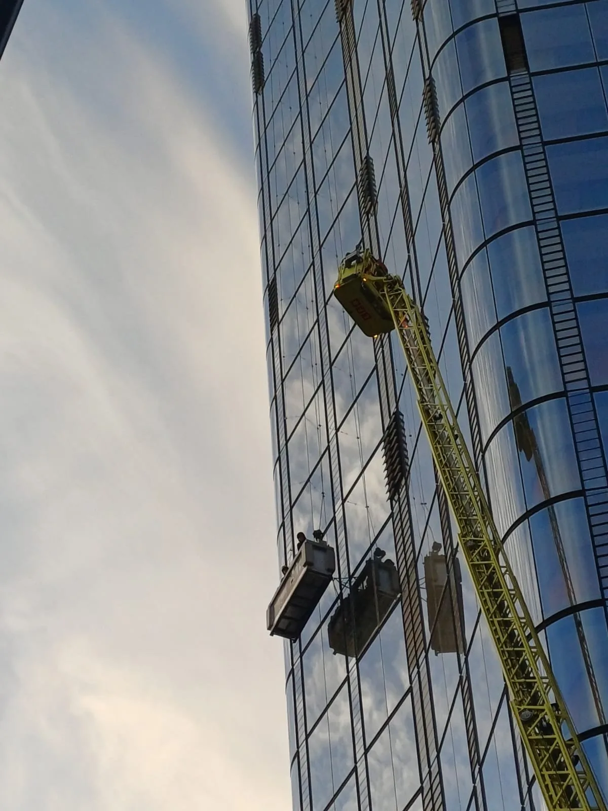 London skyscraper drama as window cleaners rescued from 15th floor after cradle malfunctions