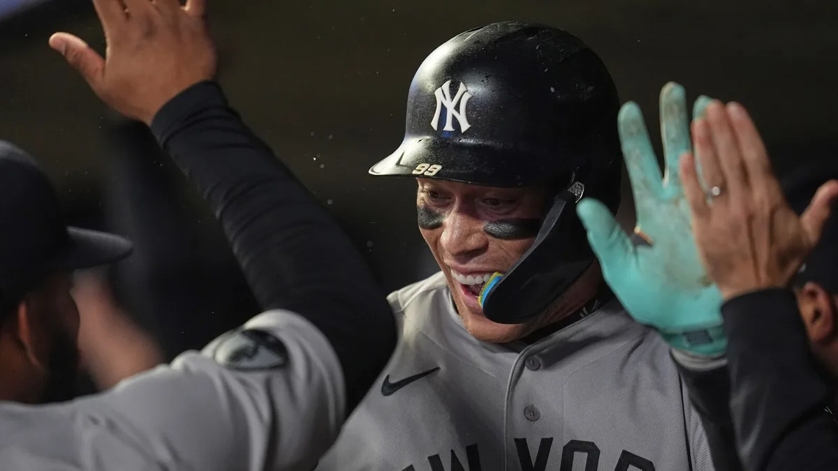 Judge's first homer since May 24 helps clinch postseason berth for Yankees in 8-3 win at Twins
