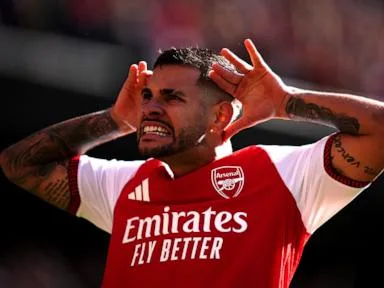 Arsenal roars back to beat Leeds as substitute Guimarães scores on home debut