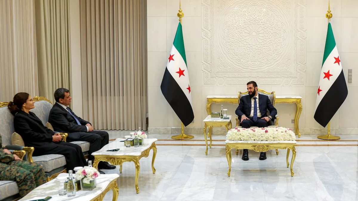 Syrian president names former commander of Kurdish-led fighting force as adviser