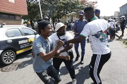 Durban ‘clean-up’ over refugee camp turns violent as police officer is allegedly hit by stone