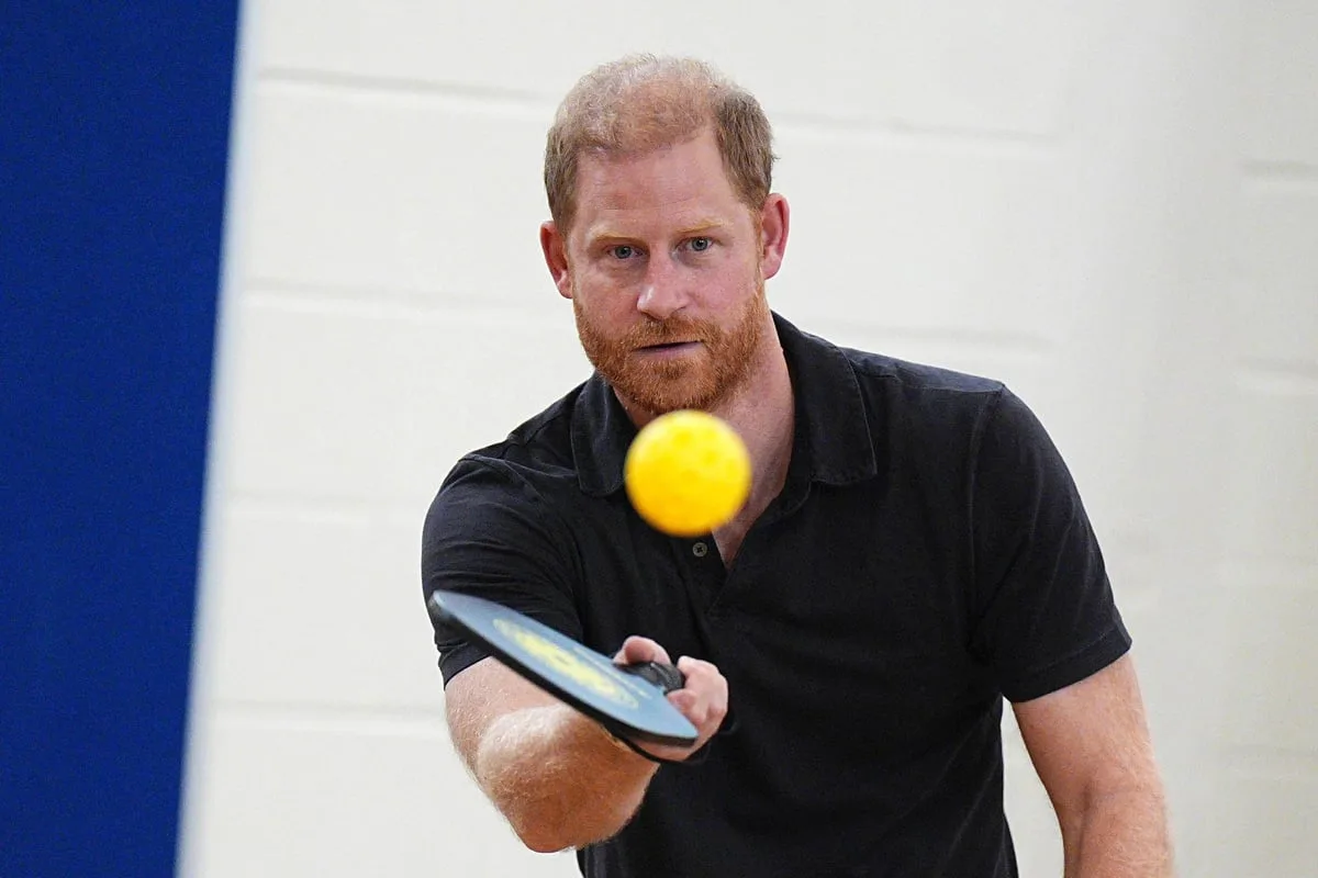 Harry plays pickleball with children as controversy continues to cloud royals