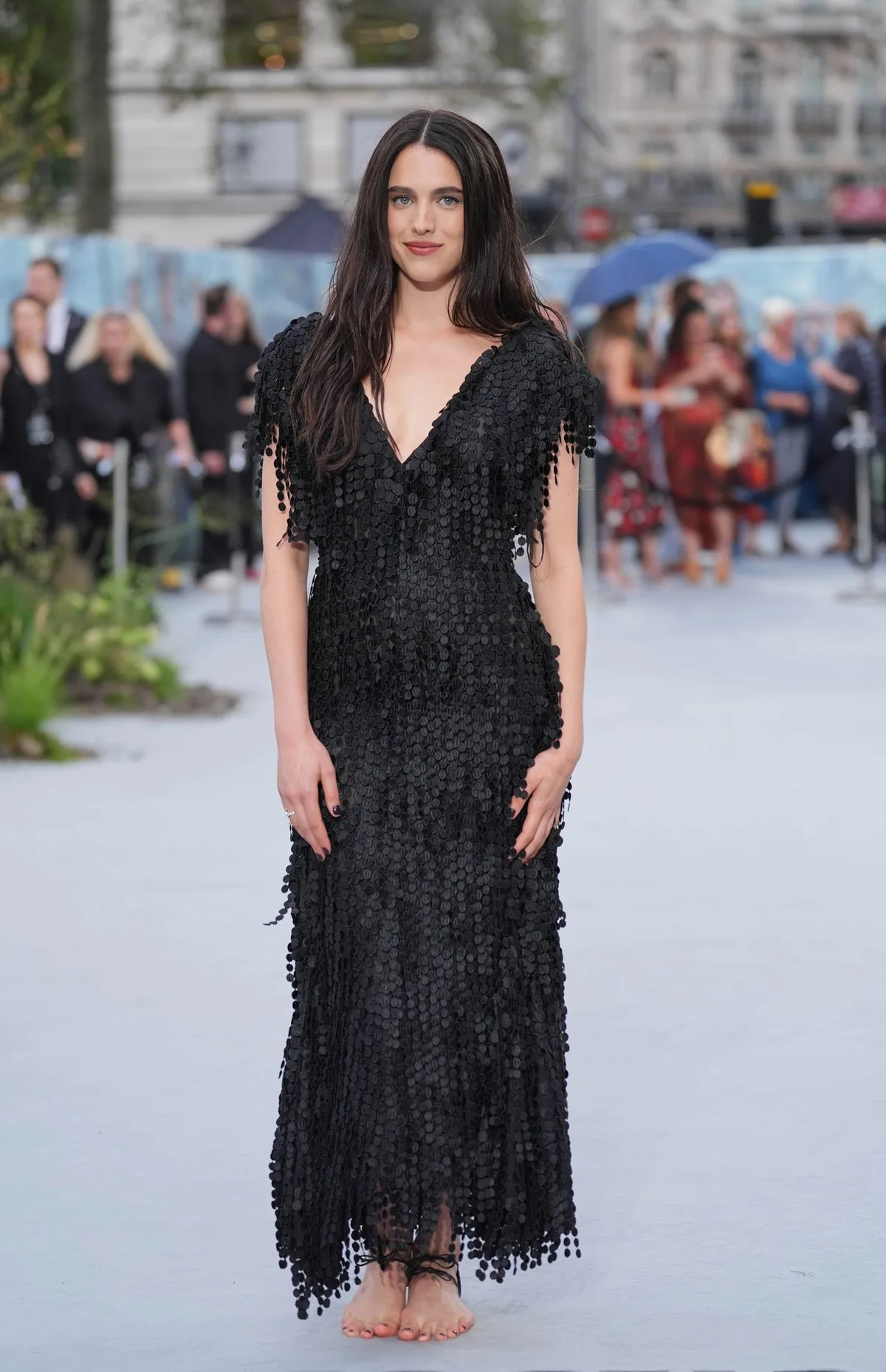 Margaret Qualley walks white carpet in barefoot Chanel sandals