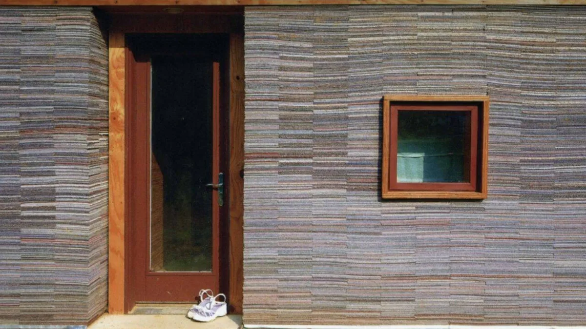 In 2002, Alabama architecture students stacked 72,000 worn carpet tiles into the walls of a family home