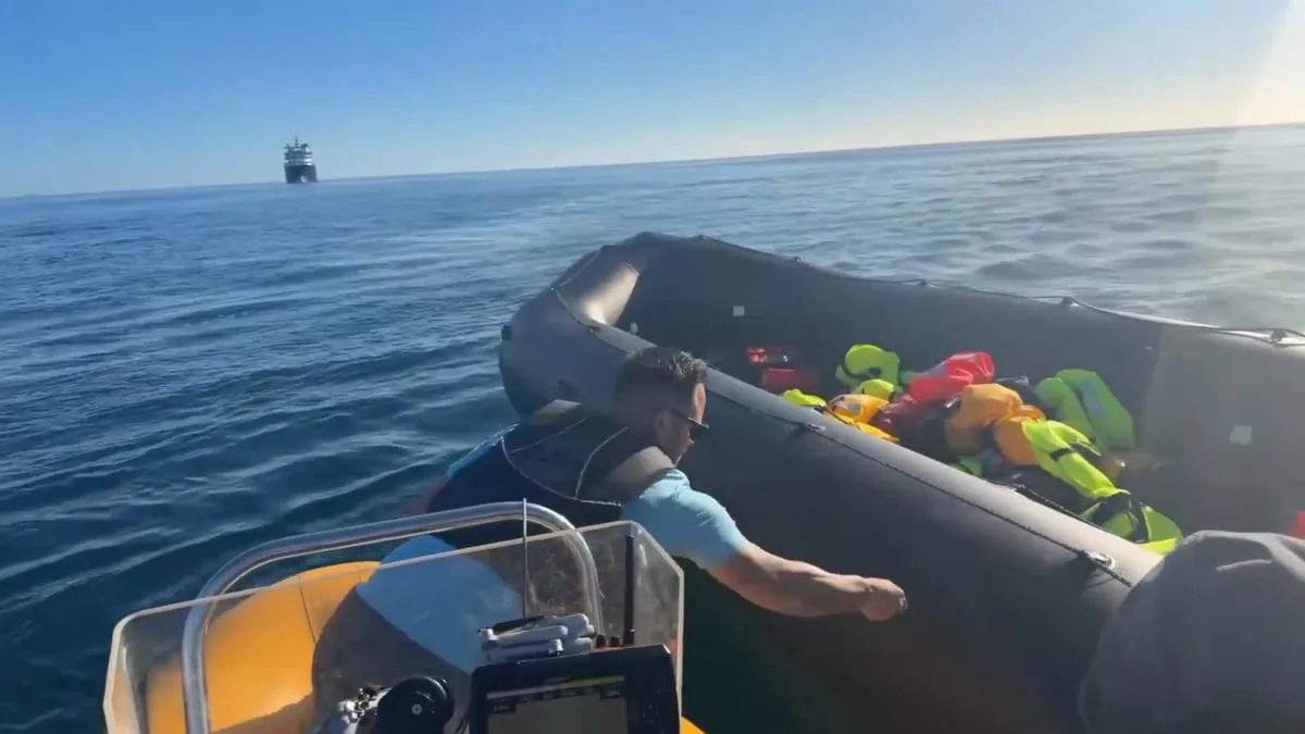 Anti-migrant activist Danny Tommo films himself slashing dinghy in the Channel