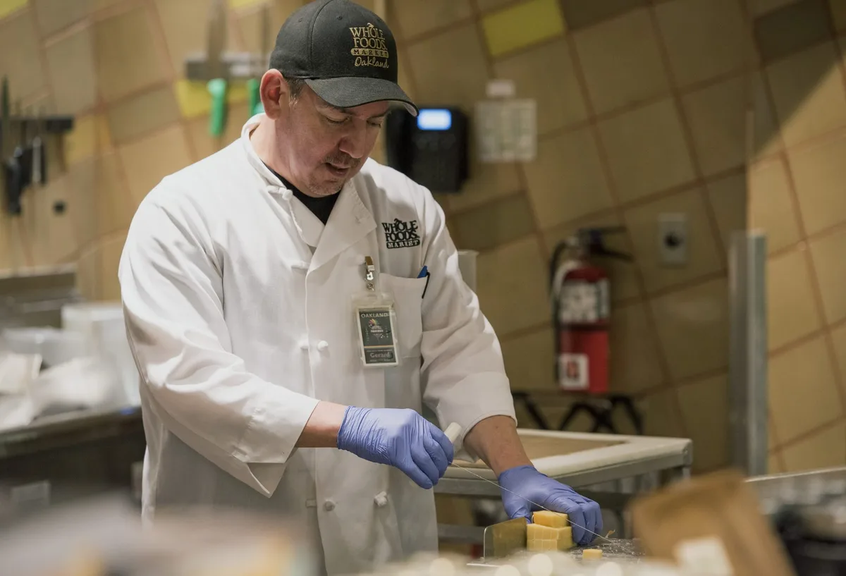 Amazon is investing $230 million in higher pay, benefits, and college perks for more than 100,000 Whole Foods workers—bumping up hourly pay to $21