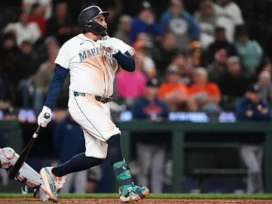 Mariners rally past Astros 6-5 in 10 innings to keep faint playoff hopes alive