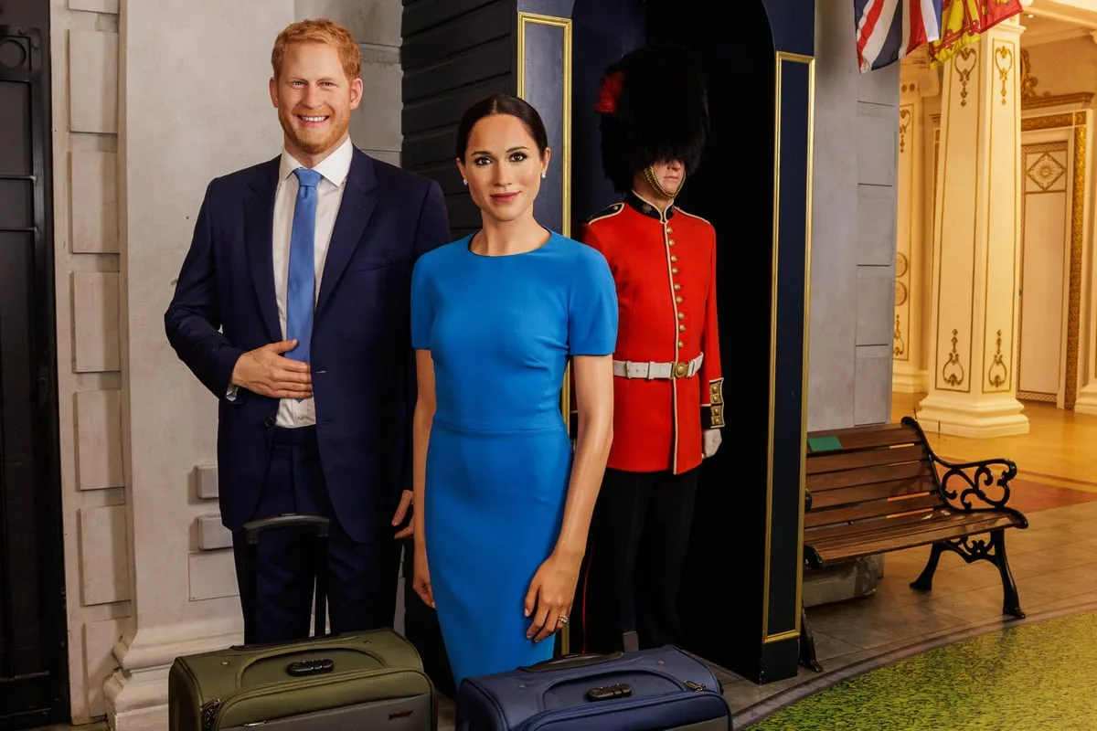 Harry and Meghan waxworks pose with suitcases and royal guard to mark UK return