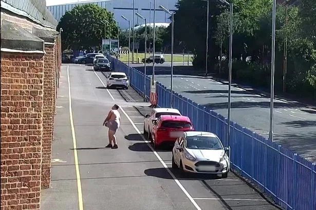 Comical moment bungling crook fails three times to throw £12,000 worth of drugs over a prison wall