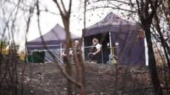 Murder investigation after wildfire uncovers body in park