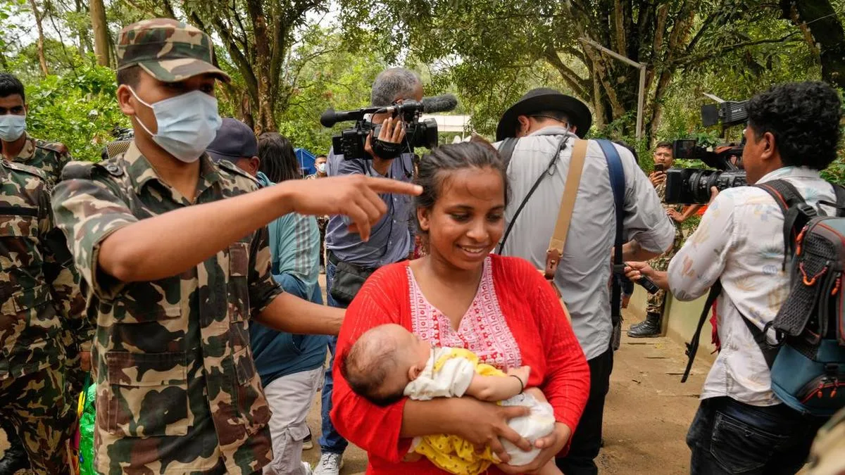 Nepal resumes flood rescue, seeks help and money